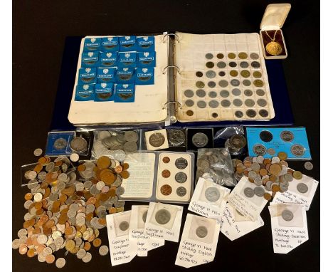 A collection of coins, mostly UK issues, including a ring binder album of UK and foreign base metal circulated issues, also C