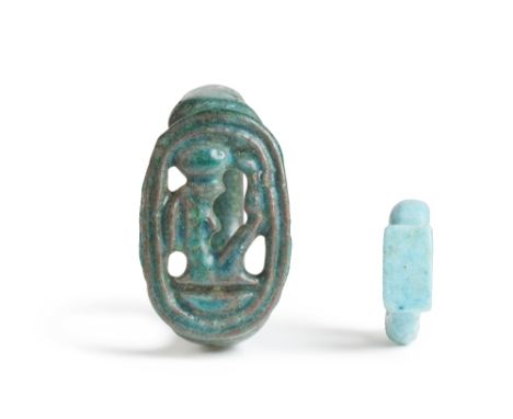  An Egyptian glazed faience openwork ring with the cartouche of Amenhotep III, and a miniature faience ring New Kingdom, circ