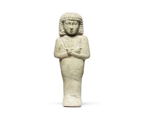  An Egyptain faience shabti with layered wig Late Period, 29th Dynasty, circa 399-380 B.C.13.4cm highFootnotes:Provenance:Bod