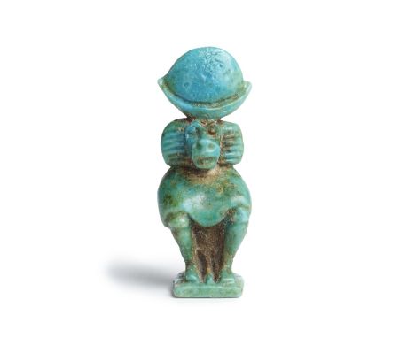  An Egyptian turquoise faience amulet of Thoth as a baboon Third Intermediate Period, circa 1069-664 B.C.4.2cm highFootnotes: