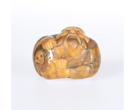 A JAPANESE STAINED IVORY NETSUKE, Meiji period, carved as a bearded elder in gowns with a geisha under his arm, unsigned. 36m