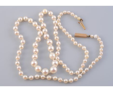 A CULTURED PEARL NECKLACE, the ninety six graduating cultured pearls strung knotted onto an integral tongue barrel clasp. Tot