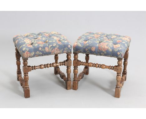 A PAIR OF 17TH CENTURY STYLE OAK AND UPHOLSTERED STOOLS, each rectangular deep button upholstered seat raised on bobbin, bloc