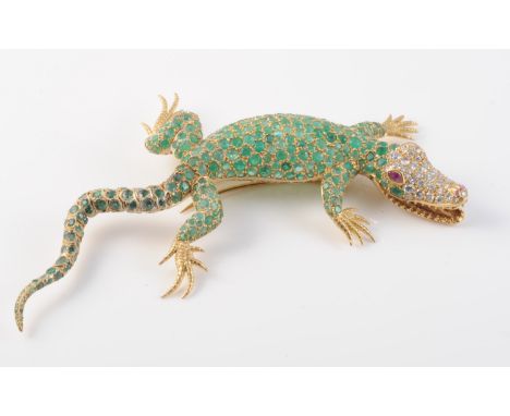 AN EXQUISITE EMERALD AND DIAMOND SET BROOCH BY GARRARD &amp; CO, modelled as a crocodile, the realistically moulded body set 