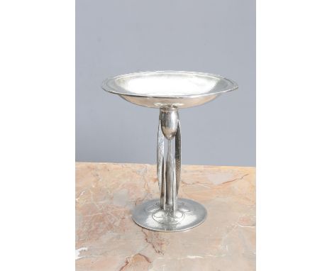 A LIBERTY &amp; CO ENGLISH PEWTER TAZZA, DESIGNED BY ARCHIBALD KNOX, the shallow bowl cast in low relief to the rim with styl