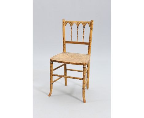 A REGENCY PAINTED FAUX BAMBOO SIDE CHAIR, with cut-away pointed arch crest rail and rush seat.