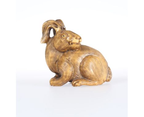 A JAPANESE IVORY NETSUKE OF A HARE, 19th Century. 4cm