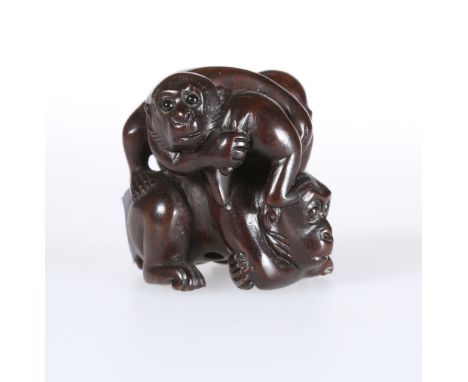 A JAPANESE WOODEN NETSUKE OF MONKEYS, signed. 3.5cm