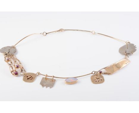 A CONTEMPORARY NECKLACE, formed of eight differing abstract metal work mounts, one set with an oval cut opal, on simple hook 