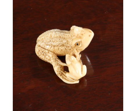A JAPANESE IVORY NETSUKE OF TOADS, Meiji period, signed. 38mm