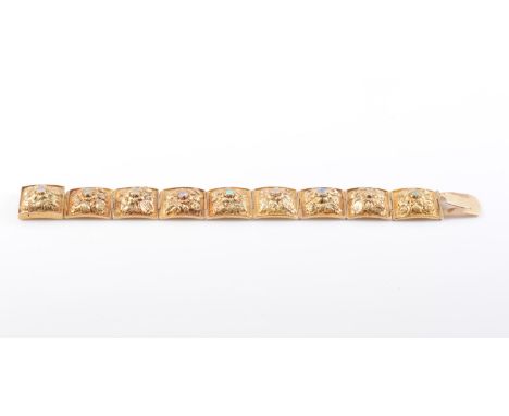 A MID 19TH CENTURY GILT METAL AND OPAL BRACELET, the nine articulated square shaped plaques with intricate and elaborate moul