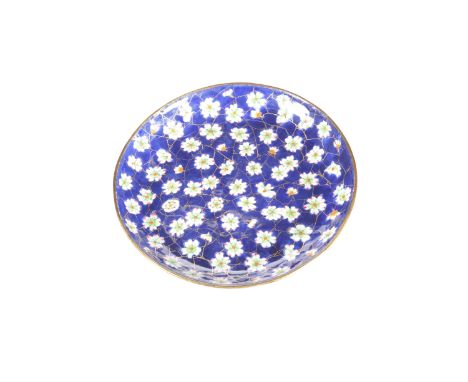 AN EARLY 19TH CENTURY ENAMEL DISH, CANTON, circular, decorated with prunus and cracked ice, the base with light blue ground. 