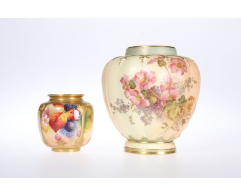 TWO ROYAL WORCESTER PORCELAIN VASES, the first of panelled form, painted with fruit and leaves, by Kitty Blake, puce mark des