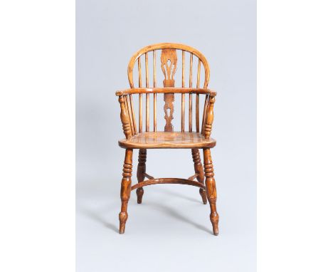 AN EARLY 19TH CENTURY ELM AND OAK CHILD'S WINDSOR CHAIR, the hoop back with pierced splat, the saddle seat raised on bobbin t