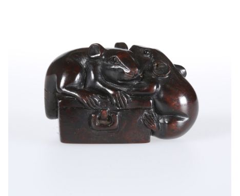 A JAPANESE CARVED WOODEN NETSUKE, of two rats climbing on a box, signed. 5cm