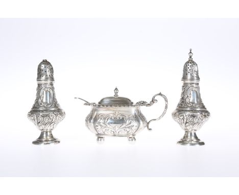 AN EDWARDIAN SILVER THREE PIECE CONDIMENT SET, WILLIAM HUTTON &amp; SONS, BIRMINGHAM 1904, the salt and pepperette of baluste