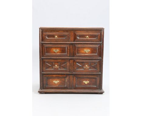 AN OAK MOULDED FRONT CHEST OF DRAWERS, probably early 19th Century, with moulded top over a pair of short drawers above three