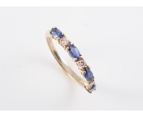 A 9CT YELLOW GOLD, SAPPHIRE AND DIAMOND RING, the four marquise cut sapphires alternately spaced with three brilliant cut dia