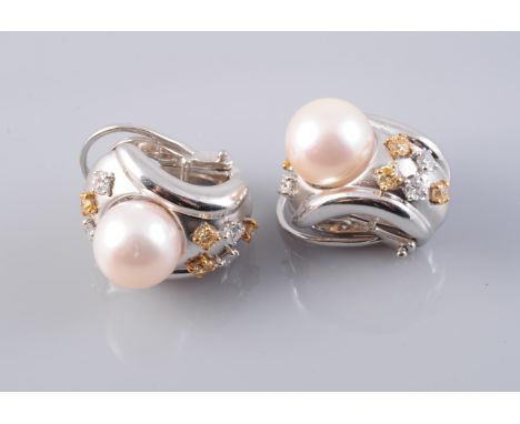 A PAIR OF 18CT WHITE GOLD CONTEMPORARY CULTURED PEARL AND DIAMOND EARRINGS, the cultured pearl set to the centre of a curved 