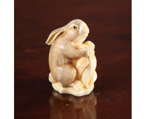 A JAPANESE NETSUKE OF A RABBIT, Meiji period, signed. 47mm
