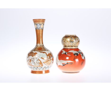 TWO JAPANESE SATSUMA VASES, c. 1900: the first of double gourd form, painted with herons against a shaded red ground beneath 