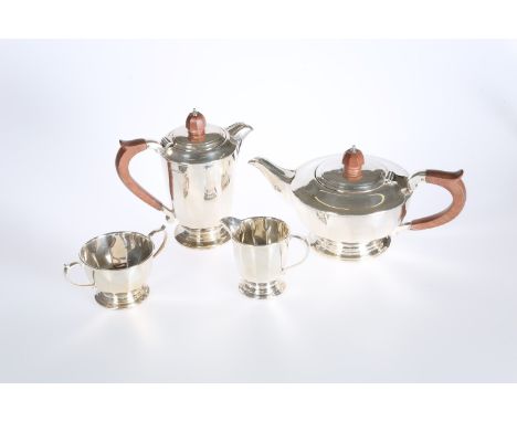 A SILVER FOUR PIECE TEA SERVICE, Mappin &amp; Webb, Sheffield 1958 and 1959, each piece of faceted form. Gross 46.5oz