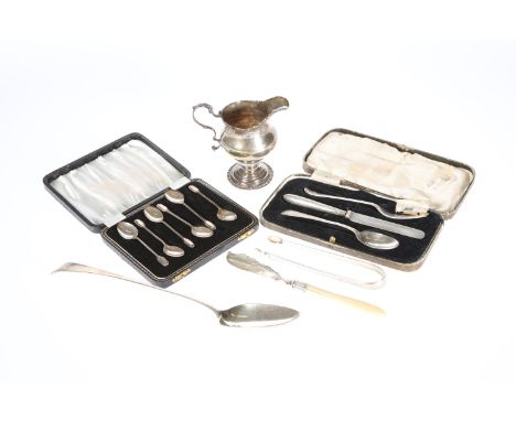 A GROUP OF SILVER, comprising a George III silver cream jug, Walter Brind, London 1768; a George IV silver basting spoon, Geo