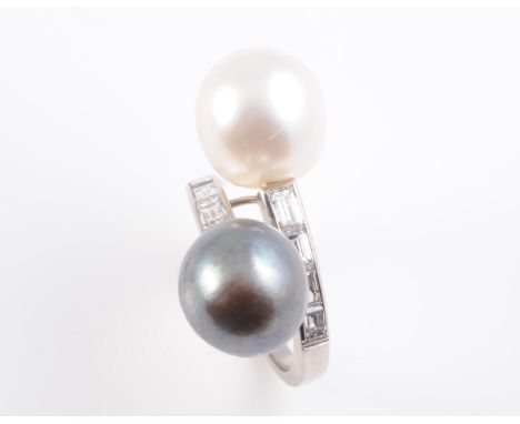 A CULTURED PEARL AND DIAMOND RING, the cross over mount set with a black cultured pearl and white cultured pearl as end termi