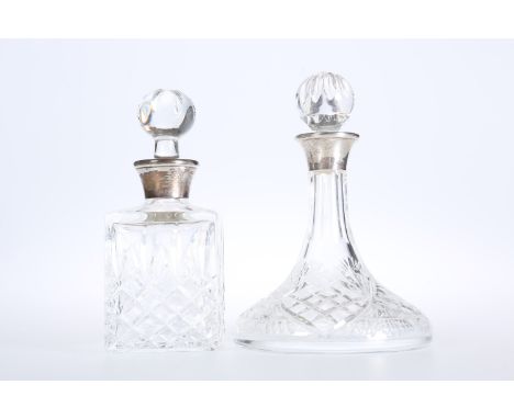 TWO SILVER MOUNTED SCENT BOTTLES, the first of square section, Birmingham 1984; the second of ships form, Birmingham 1984. (2