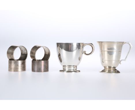 A SILVER CHRISTENING MUG, Wakely &amp; Wheeler, London 1960, with domed foot and elephants trunk form handle; together with A