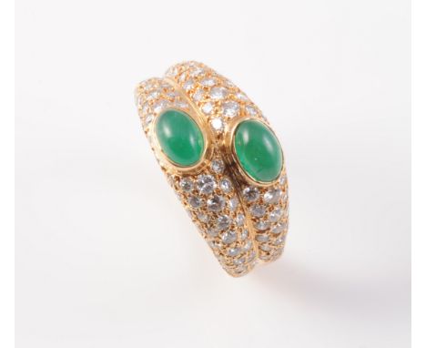 A DIAMOND AND EMERALD RING BY CARTIER, the double stranded mount set throughout with graduating brilliant cut diamonds, each 