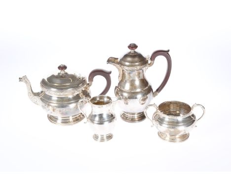 A SILVER CELTIC PATTERN FOUR-PIECE TEA SERVICE, Reid &amp; Sons, the teapot, cream jug and sugar bowl hallmarked Birmingham 1