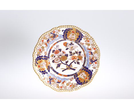 A SPODE FELSPAR PORCELAIN SOUP PLATE, CIRCA 1824-33, decorated with a Japan pattern in a palette of blue and iron red with gi