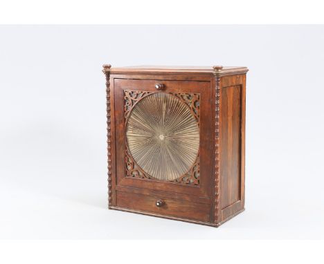 A BIEDERMEIER ROSEWOOD TABLE CABINET, EARLY 19TH CENTURY, the fretwork carved and satin backed fall front opening to reveal a