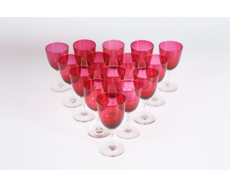 A COLLECTION OF FIFTEEN VICTORIAN RUBY AND CRANBERRY GLASS WINES, each with clear stem and foot. (15) Each approximately 13cm