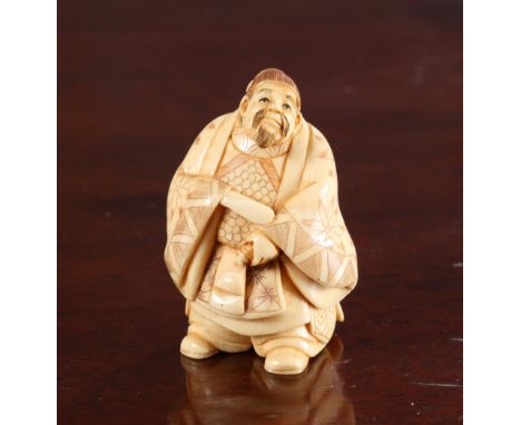 A JAPANESE IVORY NETSUKE OF A SAMURAI, Meiji period, signed. 5cm