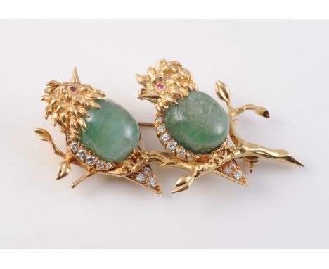 A STUNNING EMERALD AND DIAMOND SET BROOCH BY VAN CLEEF AND ARPELS, modelled as two birds perched on two intertwining branches