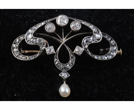 AN ART NOUVEAU DIAMOND SET BROOCH, the symmetrically designed coiling mount set throughout with graduating old cut diamond hi