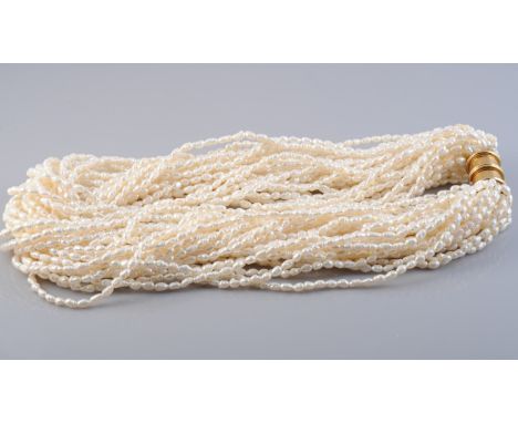 A MULTI SEED PEARL NECKLACE, of multiple strands of seed baroque pearls in twisted formation on heavy integral tongue barrel 