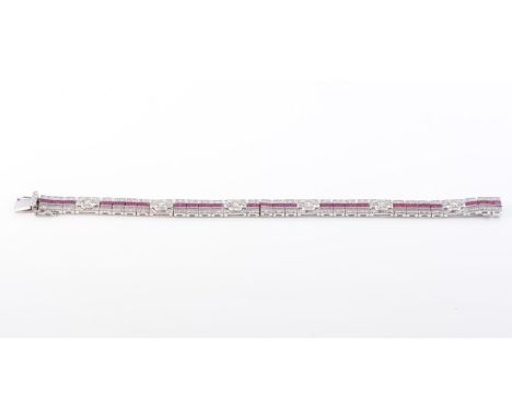 AN 18CT WHITE GOLD RUBY AND DIAMOND BRACELET, formed of articulated rectangular links centrally set with square cut rubies be