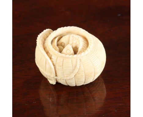 A JAPANESE IVORY NETSUKE, Meiji period, modelled as carp in a basket, signed. 35mm wide
