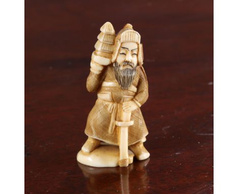 A JAPANESE IVORY NETSUKE OF A SAMURAI, Meiji period, carved holding a sword, signed. 55mm