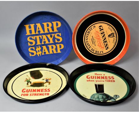 A Collection of Five Circular Pressed Metal Guinness and Harp Lager Drinks Trays 