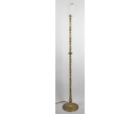 A Modern Metal Standard Lamp with Circular Base 