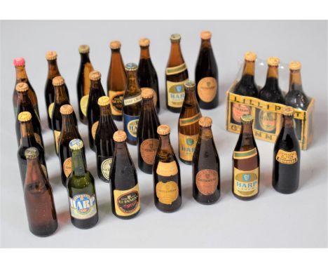 A Collection of Miniature Guinness and Harp Lager Beer Bottles 