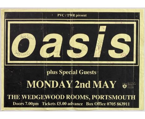 A 1994 Oasis concert poster for a date at the Wedgewood Rooms, Portsmouth (42 x 30cm) signed to front of poster in blue ink b