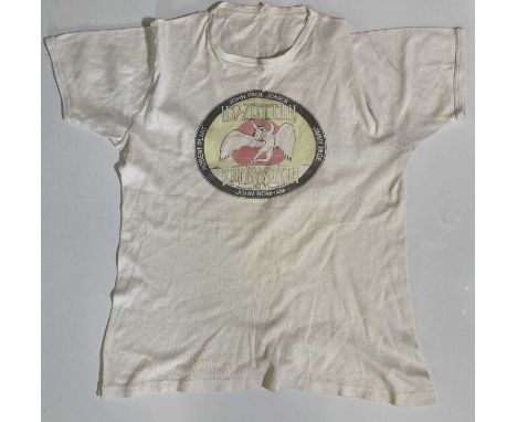 An original t-shirt c 1979 issued at the Knebworth concerts. Sizing label illegible. Good condition though print has faded.