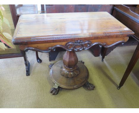 A 19th century rosewood fold over card table