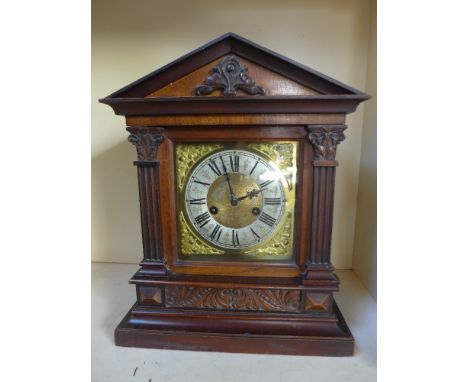 A 19th century mantel clock, with an eight day movement brass and silvered dial
Condition report: with key and pendulum
