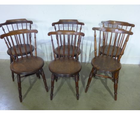 A mixed set of six penny seat stick back Windsor chairs